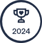 A dark blue outline of a trophy with a heart on it, symbolizing Vet excellence, above the number "2024," all within a dark blue circular border on a white background.