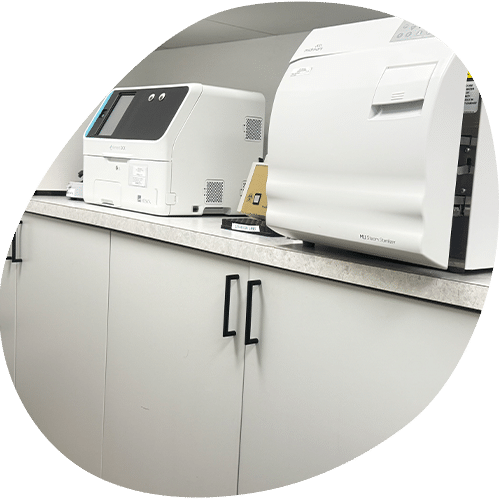 White medical laboratory equipment on cabinet counter